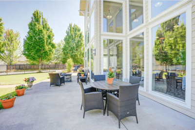 Outdoor seating area with tables and plants