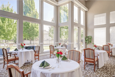 Bright dining room with tables set for a meal
