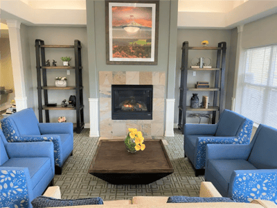 Cozy common area with a fireplace and seating