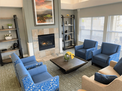 Common area with seating and fireplace