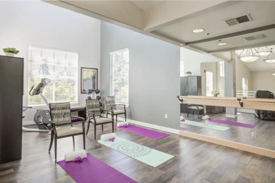 Fitness area with yoga mats and exercise equipment