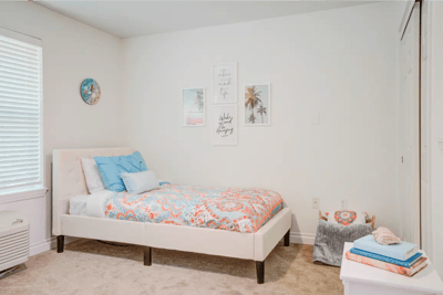 Cozy resident room with colorful bedding and decor