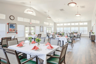 Dining area with tables set for residents