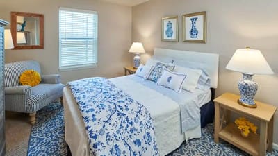 Brightly decorated resident bedroom with floral accents
