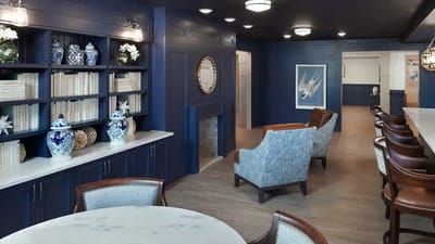 Common area with blue decor and seating