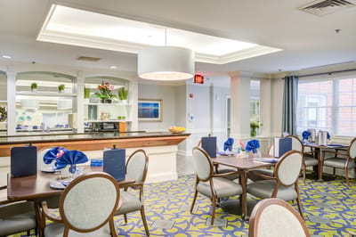 Bright dining area with tables set for meals