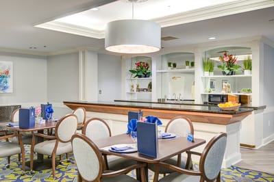 Dining area with tables set for residents
