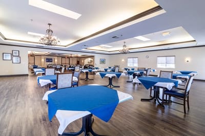 Elegant dining room with blue table settings