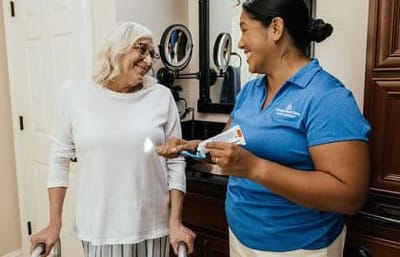 Always Best Care Of Central Ohio, nursing home in Westerville, OH — Senior caregiver assisting elderly woman in a home setting