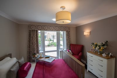 Cozy resident room with seating and natural light