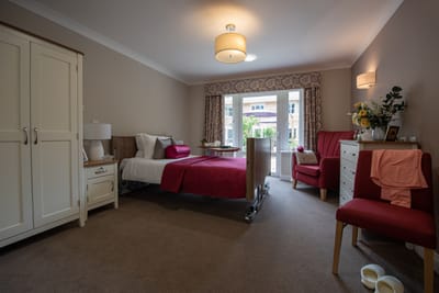 Well-furnished resident room with natural light
