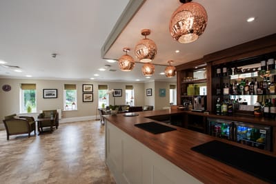 Interior view of a bright common space with a bar