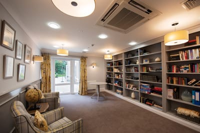 Interior of a cozy library with seating area