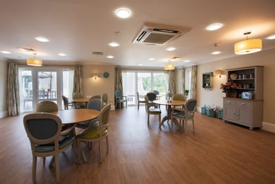 Bright and welcoming common area with tables and chairs