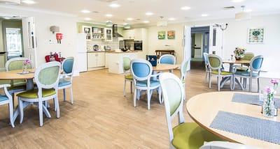 Bright dining area with tables and chairs