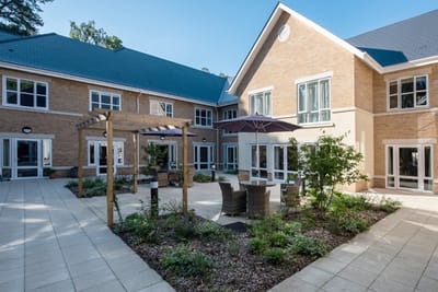 Outdoor courtyard area with seating and plants