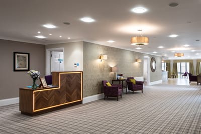 Bright interior lobby with reception area and seating