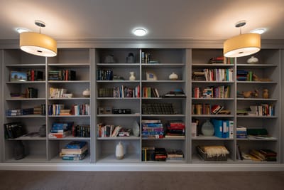 A well-organized bookshelf in a common area