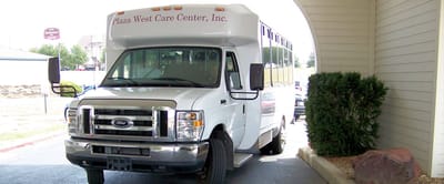 Facility shuttle bus near entrance