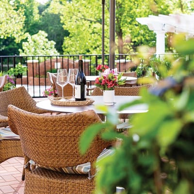 Outdoor dining area with tables and flowers