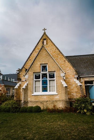 Exterior view of a building with a stained glass window
