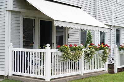 Outdoor patio with flowers and awning