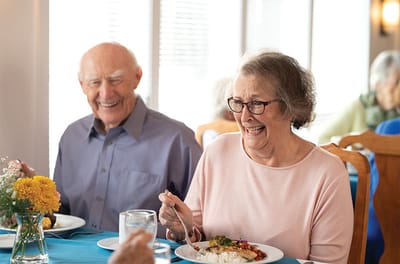 Residents enjoying a meal in the dining room