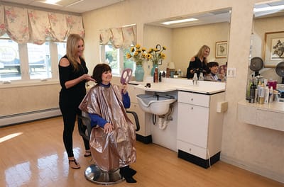 Residents receiving haircuts in the salon