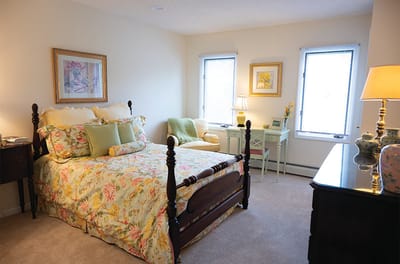 Cozy bedroom with floral bedding and natural light