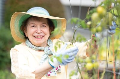 Resident enjoying gardening outdoors