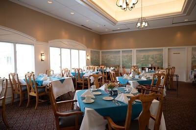 Dining room setup with tables and chairs