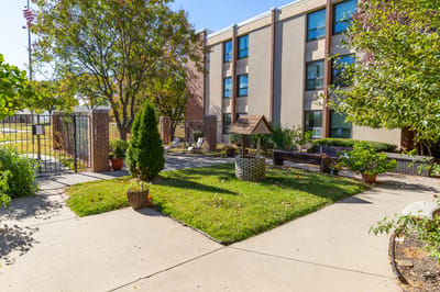 Outdoor space with landscaping and a building facade