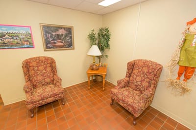 Cozy seating area with patterned chairs and decor