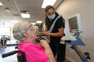 Resident engaging in therapy session with staff member