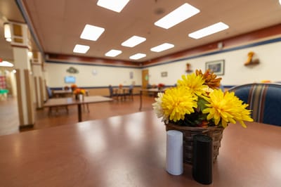 Dining area with flowers on the table