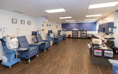 Interior view of a healthcare room with treatment chairs