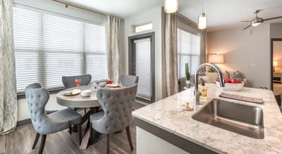 Bright dining area with a table and meals served