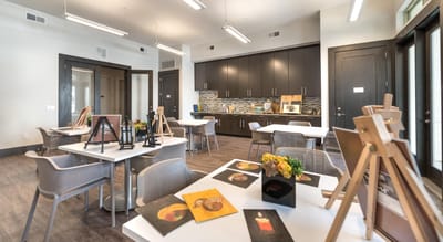 Interior dining area with food displays and easels