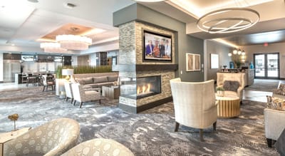Stylish lobby area with seating and fireplace