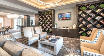 Common area with comfortable seating and bookshelves
