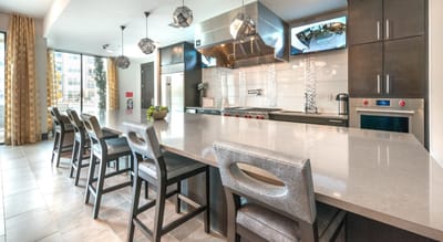Modern dining room with gray chairs and counter