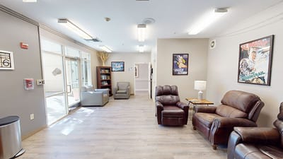 Lounge area with comfortable seating and artwork