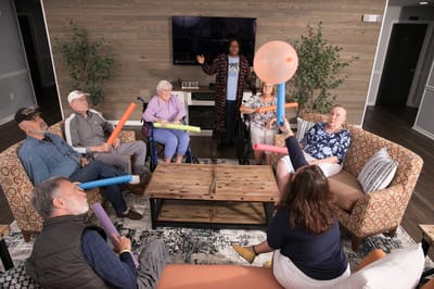 Residents participating in a group activity in a common area