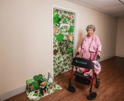Resident celebrating with St. Patrick's Day decorations