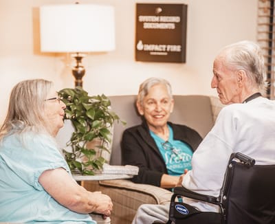 Residents enjoying conversation in a cozy common area