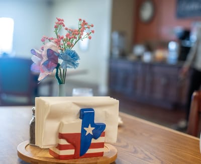 Table centerpiece in a dining area with tissue holders
