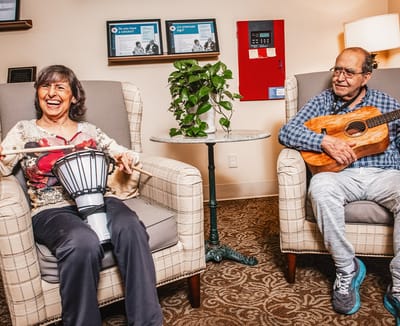 Residents enjoying a music activity with instruments