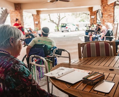 Residents enjoying an art activity on a patio