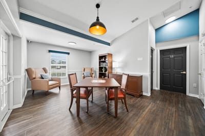 Bright common area with seating and a table