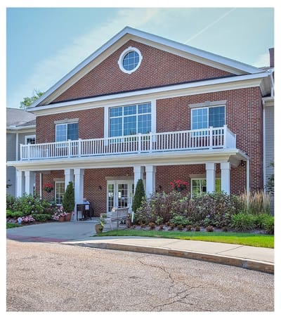 Exterior view of assisted living facility with porch
